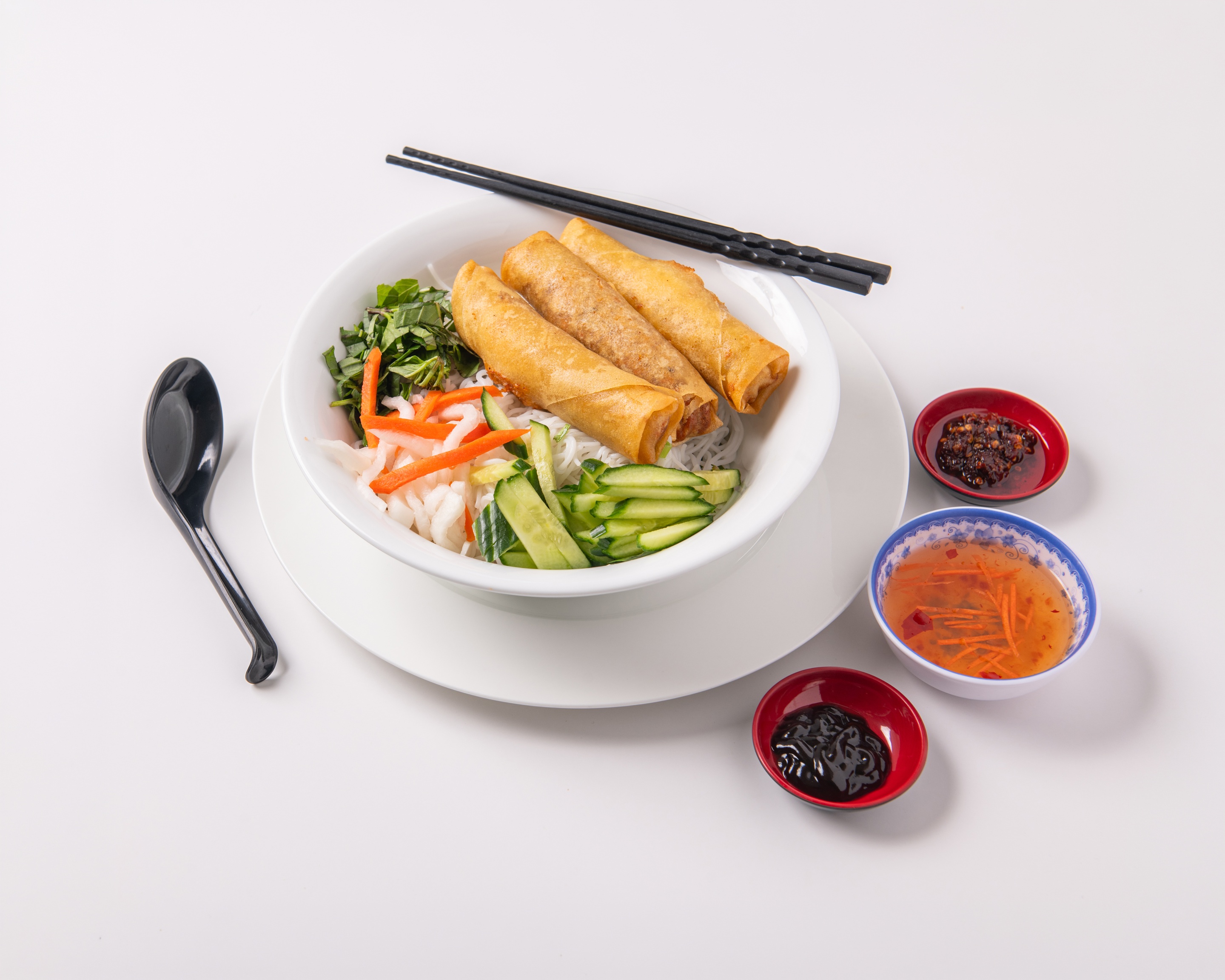 Bún Chả Giò (Bun Cha Gio) - Deep-fried spring rolls on vermicelli with assorted vegetables