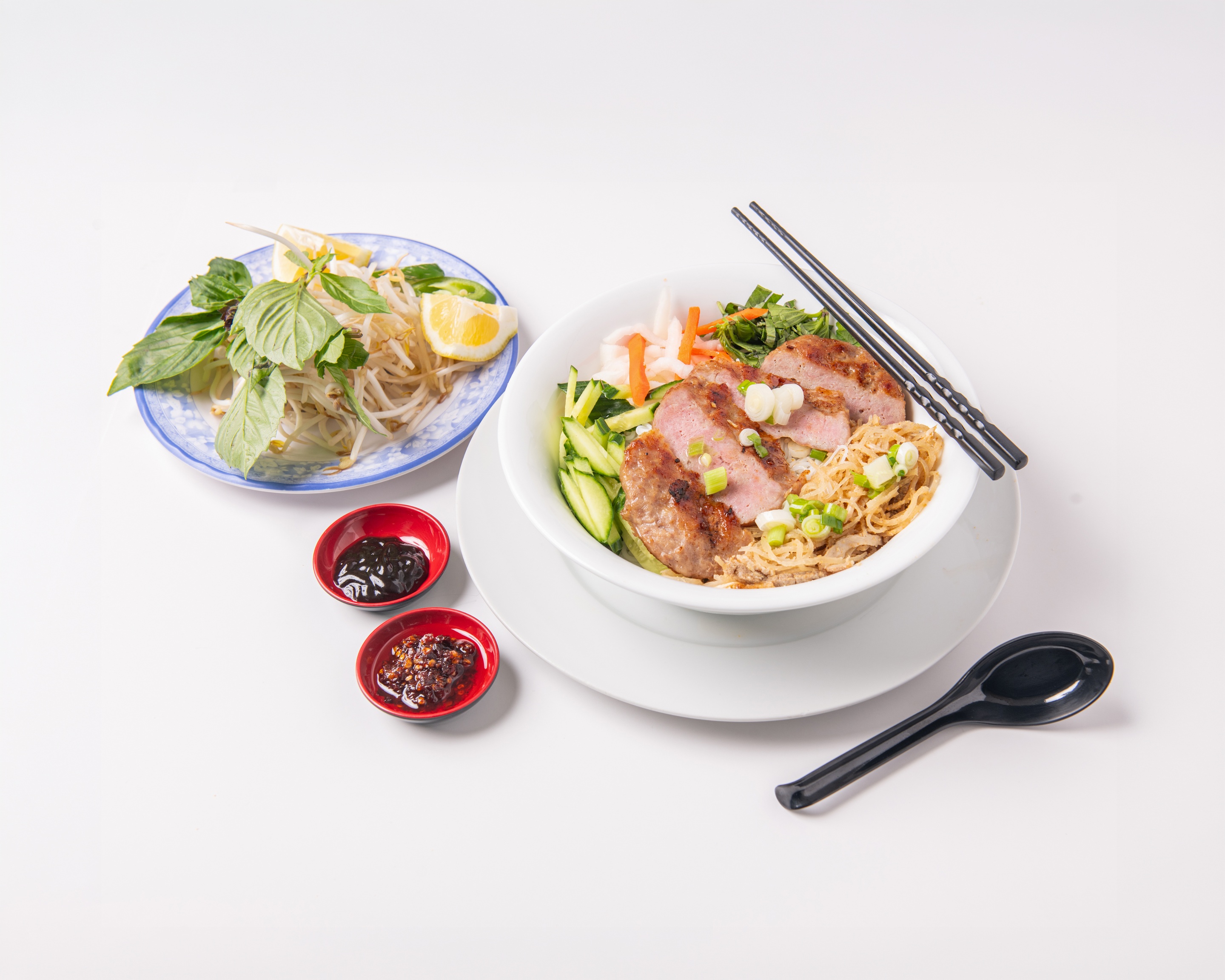 Bún Nem Nướng (Bun Nem Nuong) - Grilled meat patty on vermicelli with assorted vegetables